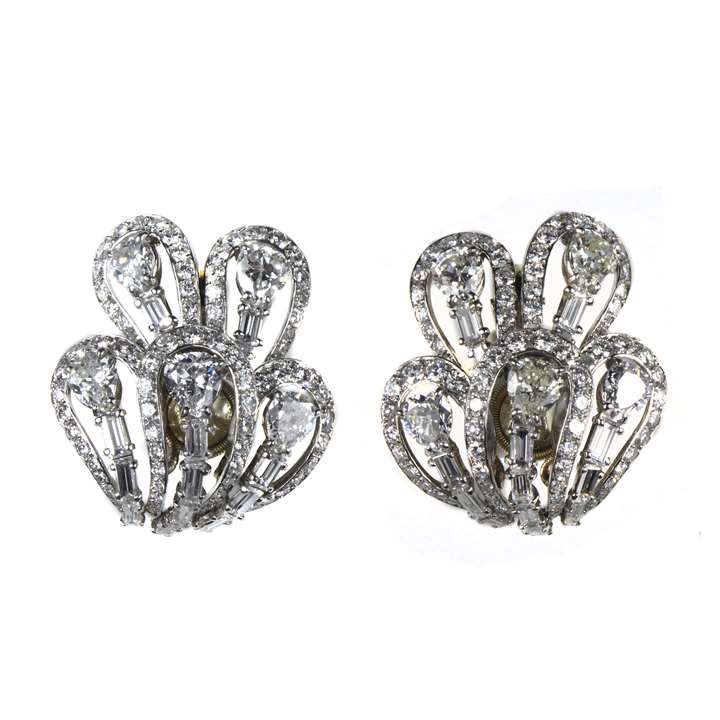 Pair of diamond openwork loop earrings of stylized floral design
